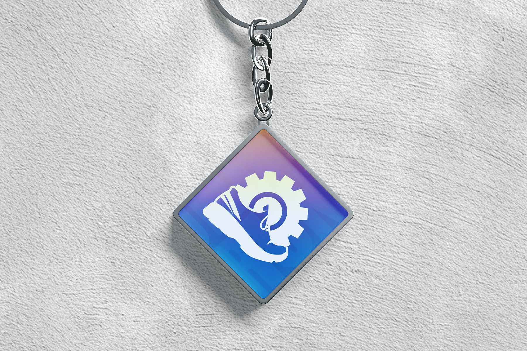 Keychain with a sneaker and gear icon